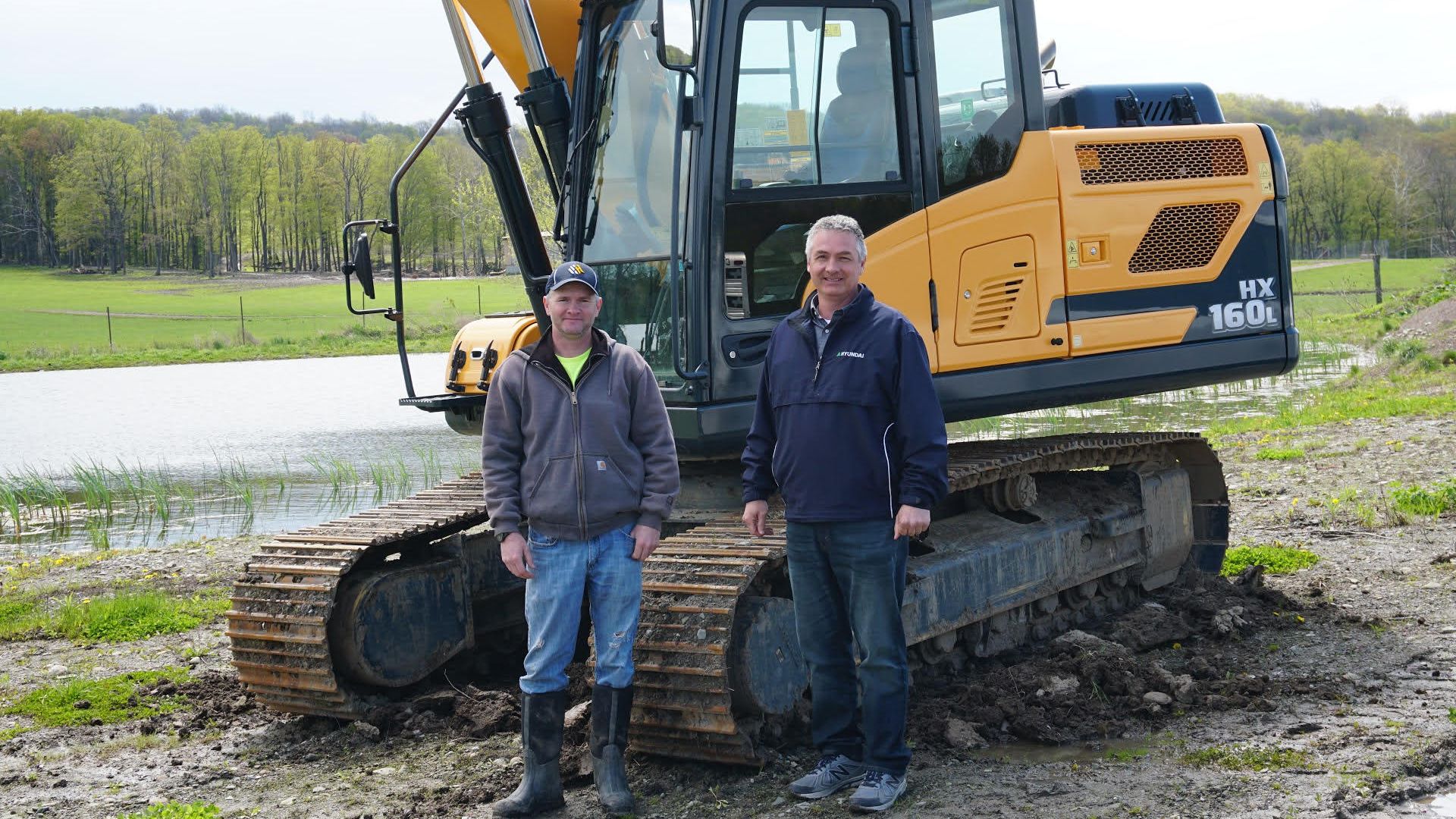 Zehler Excavating LLC Owner Stands with Greg Newell George & Swede Owner